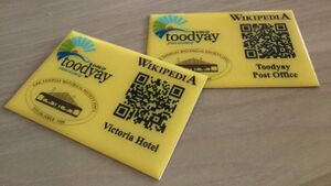 yellow plaques with QR codes